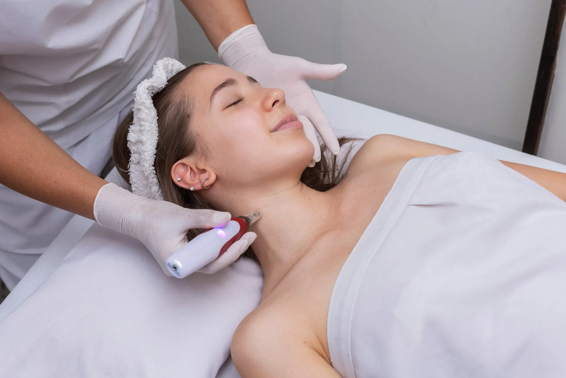 Woman Lying on bed getting chemical peel