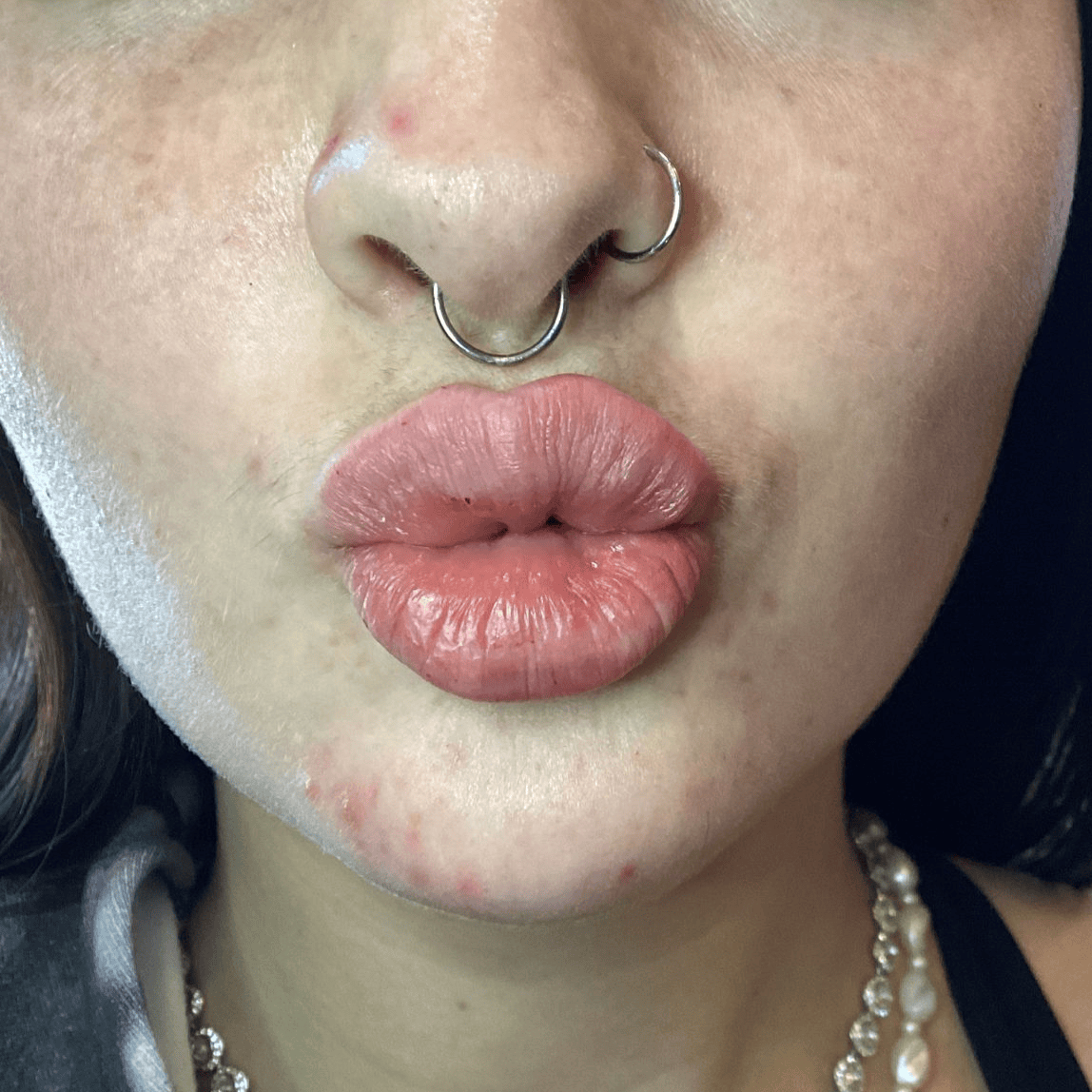 a woman with a nose ring and a nose ring